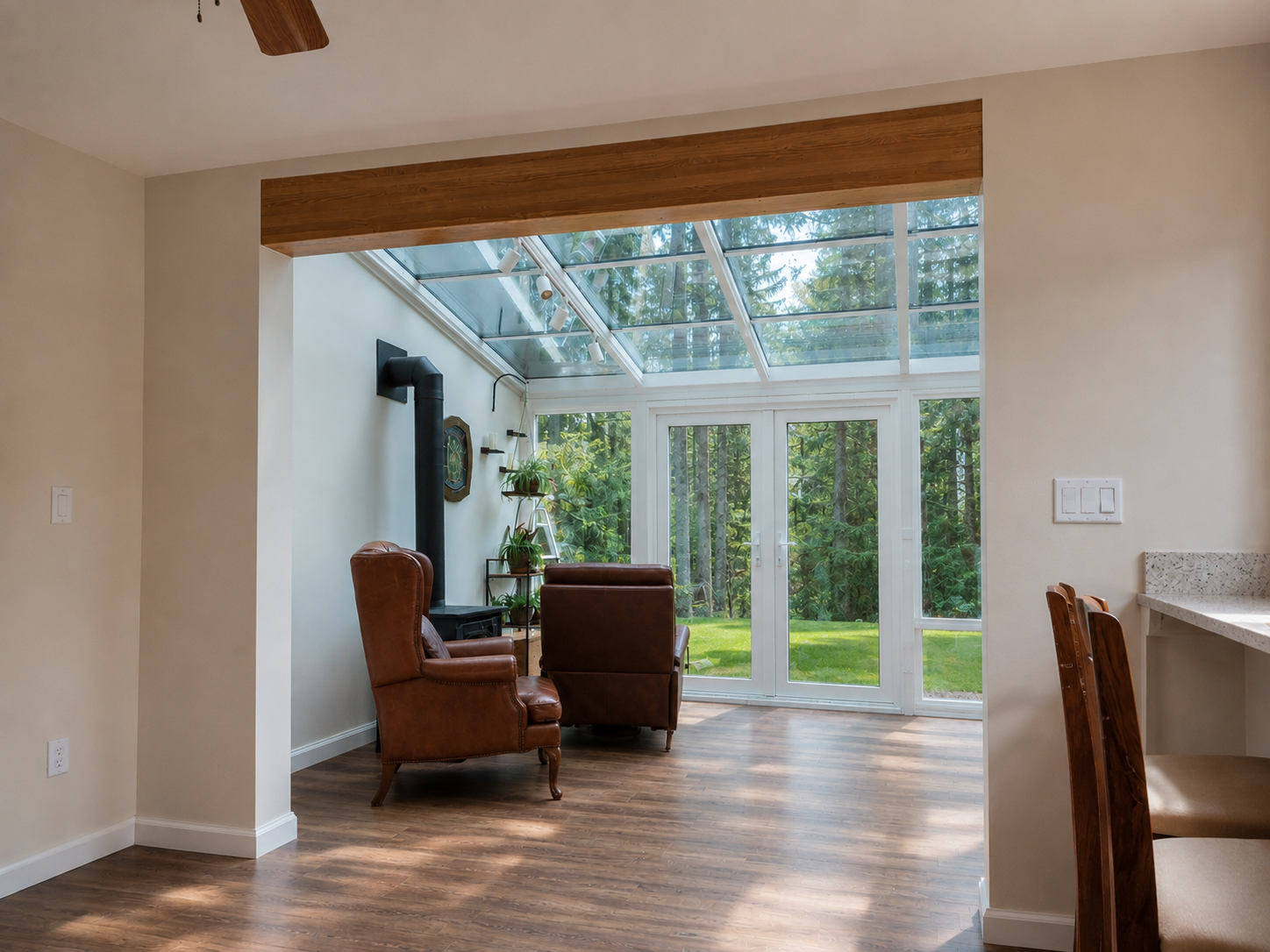 Opening to sunroom after — stained wood header beam installed, framing the view