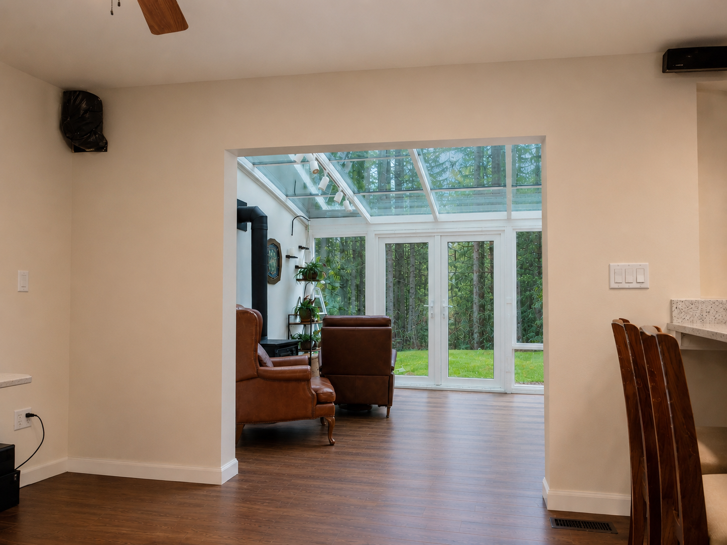 Opening to sunroom before — plain drywall edge above the opening